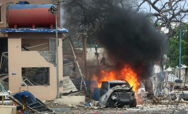 A vehicle burns at the scene of a suicide bomb attack outside Nasahablood hotel in Somalia’s capital Mogadishu