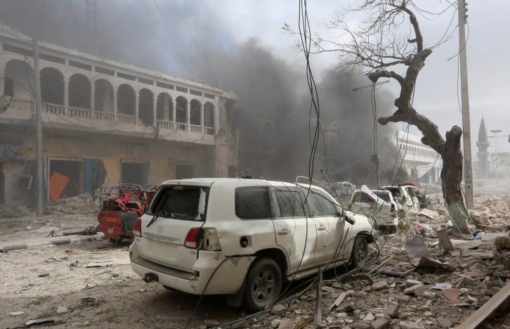 Destroyed cars are seen near the scene of an explosion in front of Dayah hotel in Somalia’s capital Mogadishu